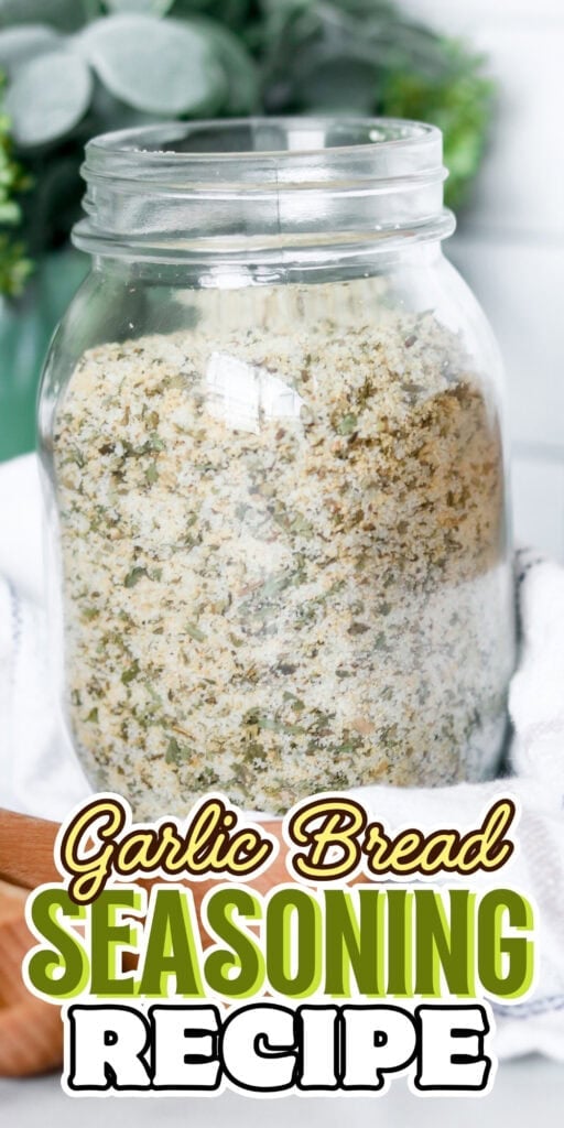A jar filled with garlic bread seasoning sits on a white cloth.