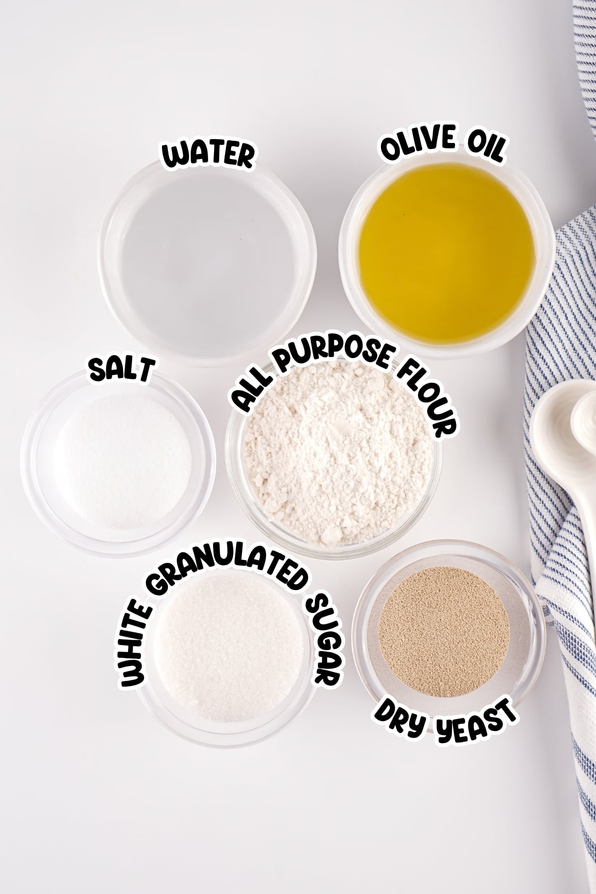 Six labeled bowls: water, olive oil, salt, flour, sugar, and dry yeast.
