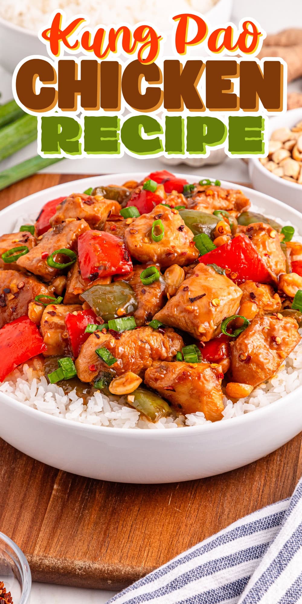 Bowl of Kung Pao chicken with rice, topped with peanuts and green onions.