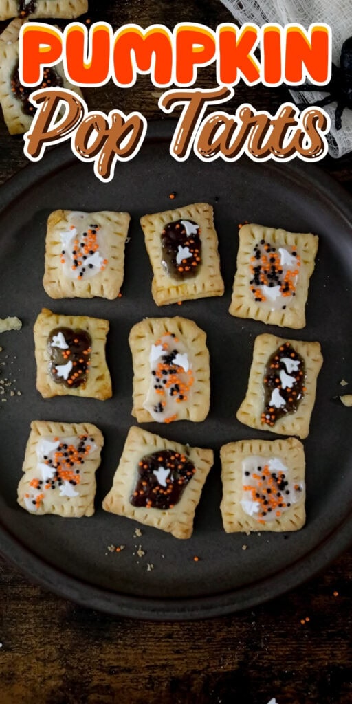 Nine decorated pumpkin pop tarts on a round dark plate with colorful sprinkles.