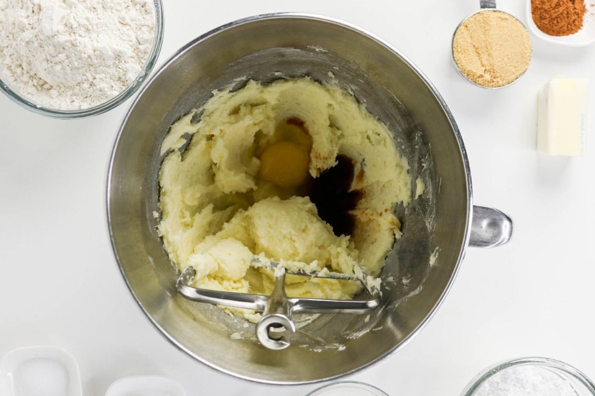 Cream butter and sugar, then add egg and vanilla to make cookie dough.