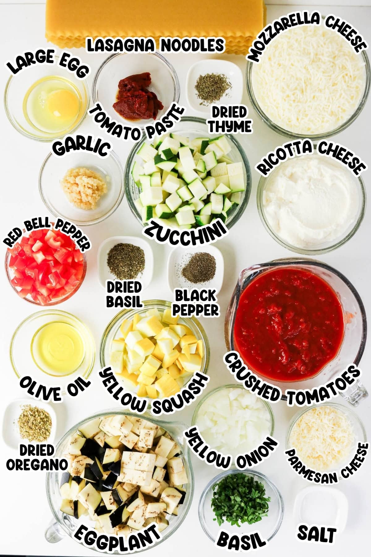 Lasagna ingredients in bowls, including cheese, veggies, spices, and sauces.