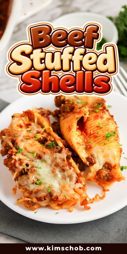 Two beef-stuffed pasta shells on a white plate.