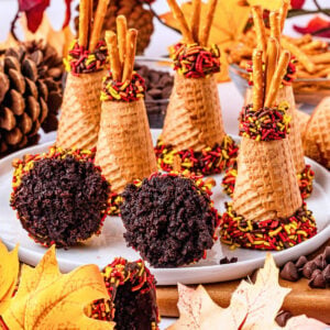 Waffle cone teepees decorated with chocolate and autumn-colored sprinkles.