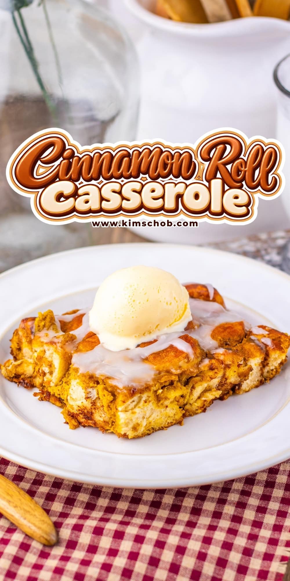 A serving of cinnamon roll casserole topped with a scoop of vanilla ice cream.