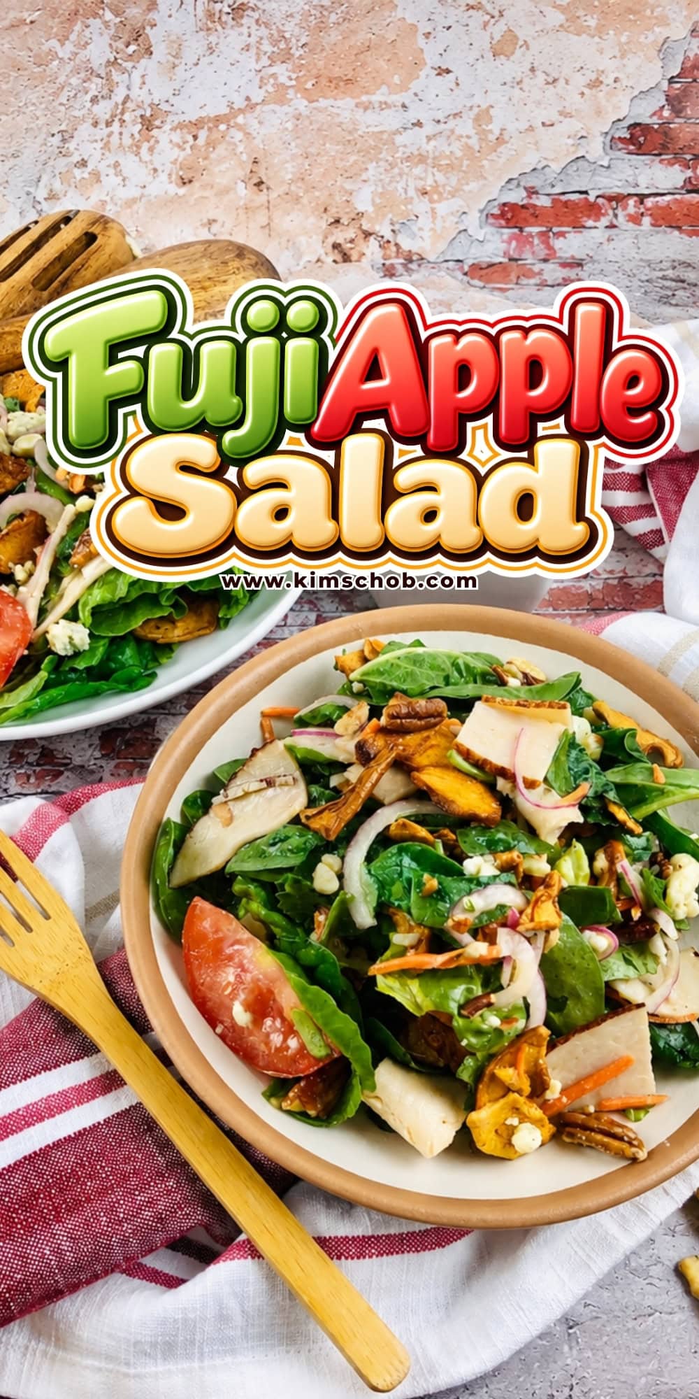 Fuji Apple Salad in a bowl with a wooden fork on a napkin.