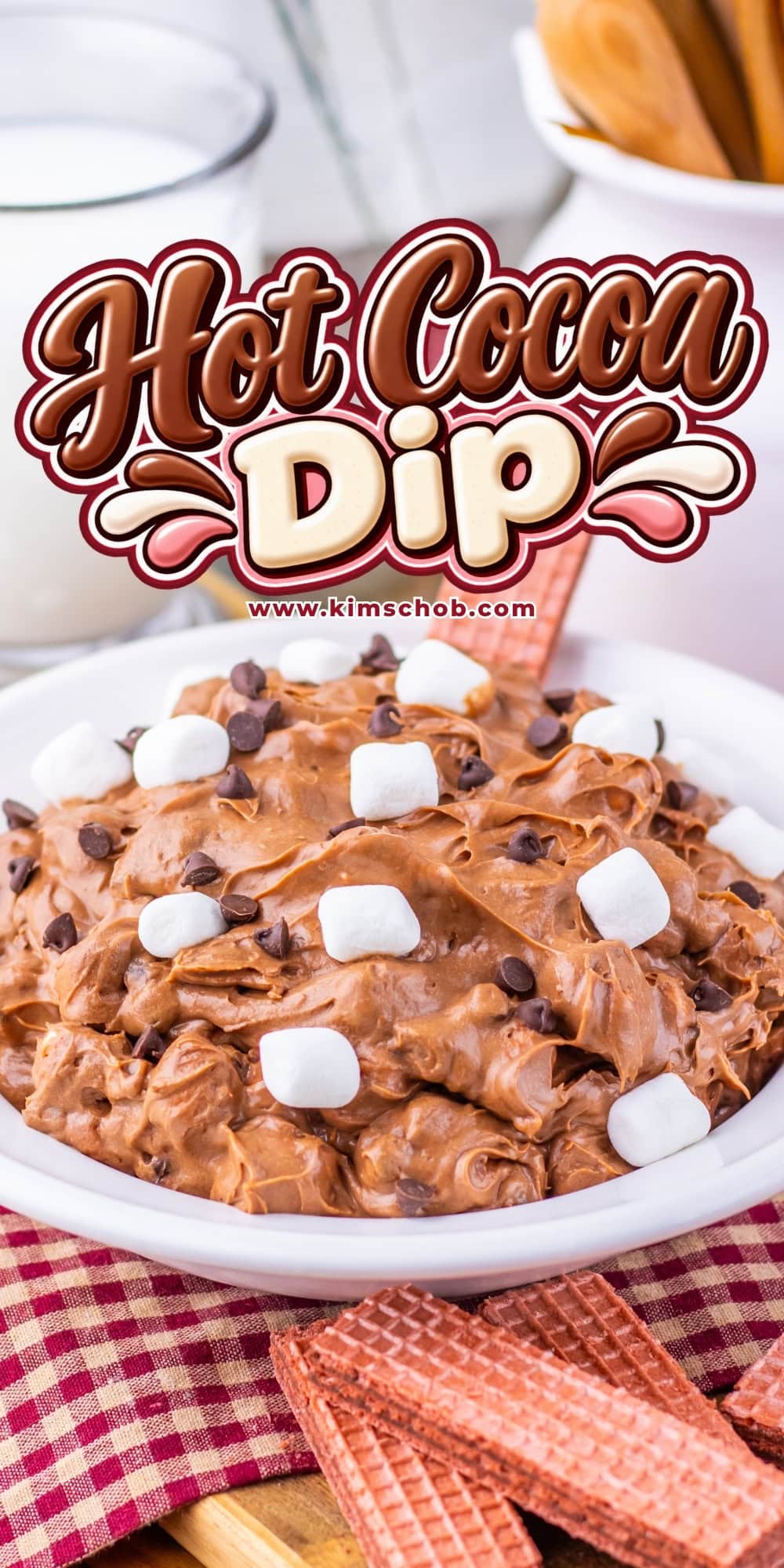 Bowl of chocolate dip topped with marshmallows, served with wafer cookies.