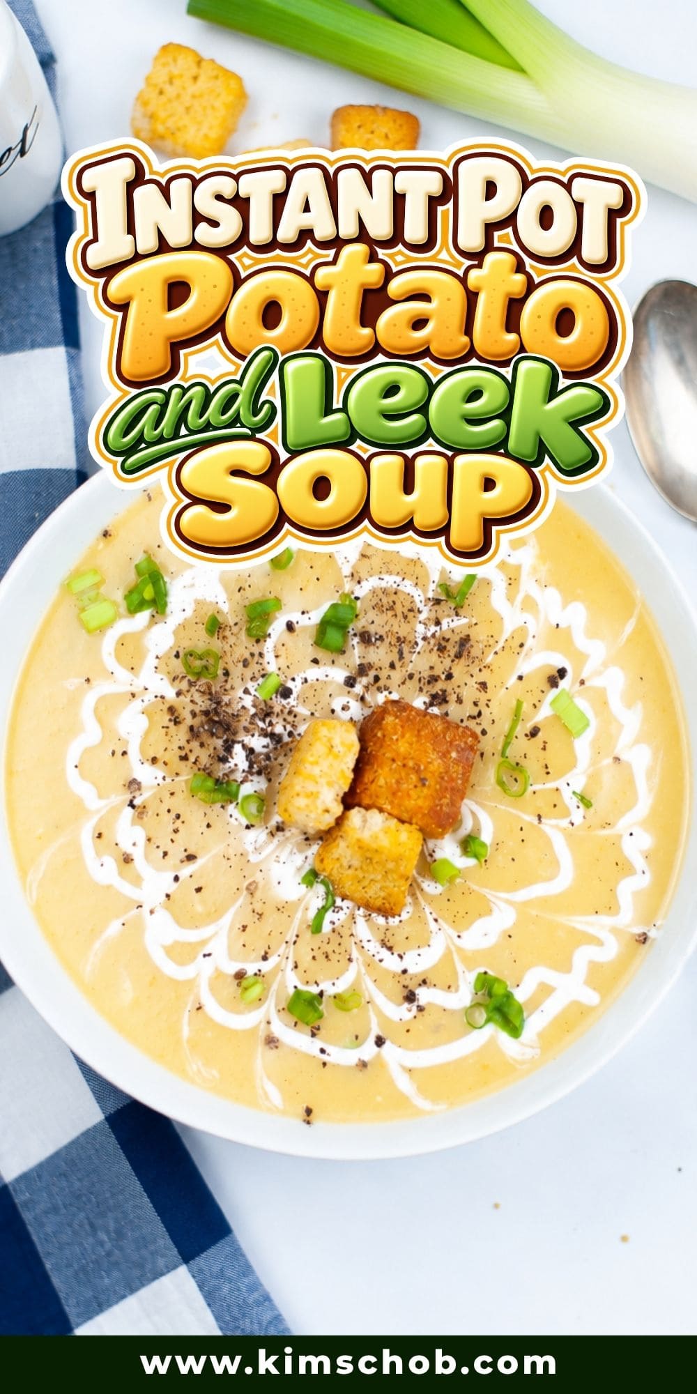 Bowl of potato and leek soup topped with croutons, cream, and chives.