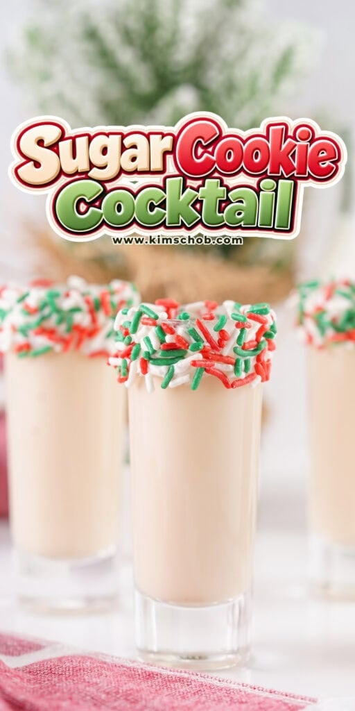 Three shot glasses filled with a beige drink and rimmed with holiday sprinkles.