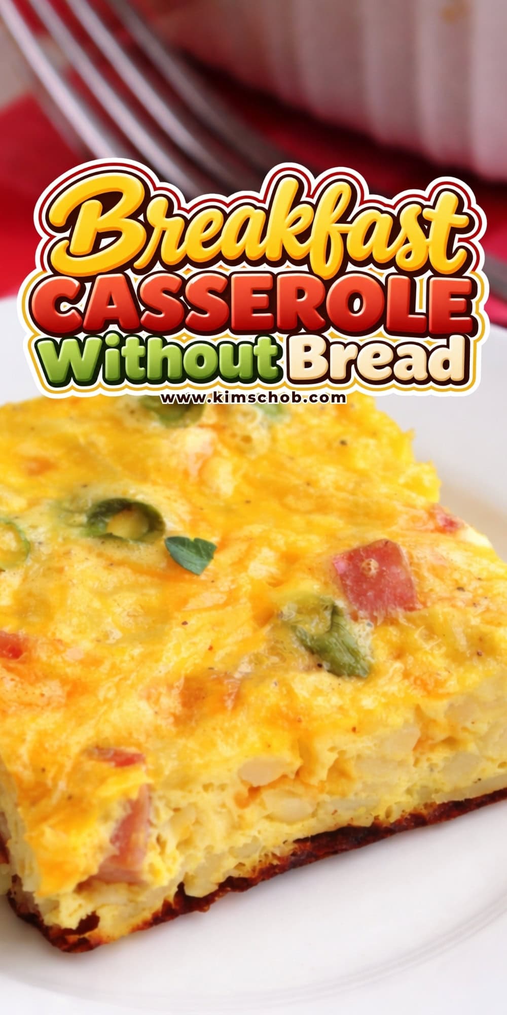 Square piece of breakfast casserole with peppers and ham on a white plate.