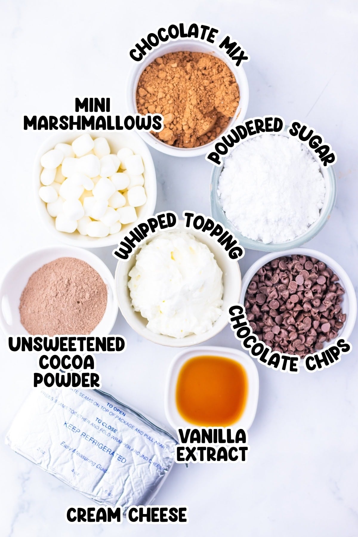 Bowls of ingredients: chocolate mix, marshmallows, sugar, cocoa, chips, vanilla.